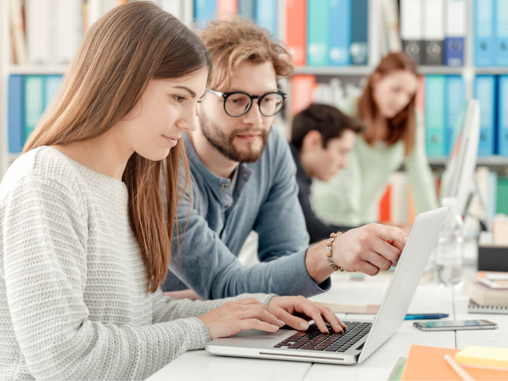 UNIVERSITY STUDENTS STUDYING TOGETHER